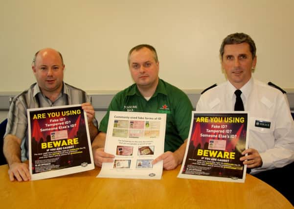 Launching the new licensing ID posters are, from left, Constable Paul Larkin, licensing offcer; Billy Campbell, Mason's Bar, Londonderry; and Chief Inspector Tony Callaghan, Foyle Area Commander.