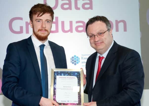 Employment and Learning Minister Dr Stephen Farry has hosted an awards ceremony for graduates from the Deloitte Analytics Training Academy (DATA) at Belfast Metâ¬"s e3 campus. Michael Scott from Ballymena is pictured receiving his graduation certificate from Minister Farry.