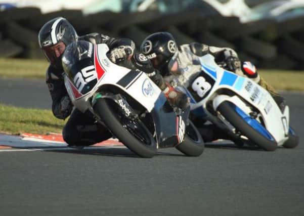 Padraig Graham holds off Christian Elkin in the second 125GP/Moto3 race. Picture: Roy Adams.
