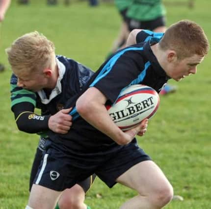 HOME 'N TRY. Ballymoney U-18 player, Ciaran Neill, who scored one of his side's tries against Clogher Valley on Saturday.INBM44-14 020SC.