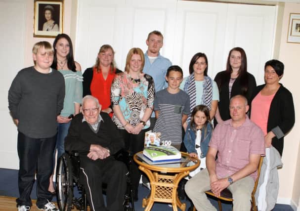JUST GRAND. Johnny Gallagher, pictured at his 100th Birthday celebrations along with his Grandchildren and Great Grandchildren  some of whom travelled from Australia and England, at the RBL on Tuesday night.INBM44-14 013SC.