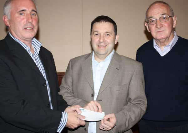 Alan Shanks, Secretary of Kells Pigeon Club, andMervyn Gregg, Club Treasurer, present North Antrim UUP MLA Robin Swann with a cheque for £910 for Barbour Ward of the Royal Victoria Hospital for Sick Children. The cash was raised from the proceeds of the Clubs charity pigeon auction.