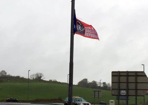 An IRSP flag hangs near Skeoge Roundabout on the Skeoge Road yesterday afternoon.