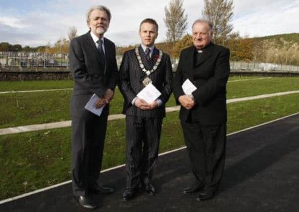 Rev John Dickinson, Mayor Thomas Hogg and Fr John Forsythe at the ceremony of dedication/consecration at Carnmoney Cemetery. INNT 44-523CON