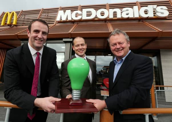 Environment Minister, Mark H Durkan; Chris Allen, Keep Northern Ireland Beautiful and local McDonald's franchisee Des Lamph.  INCT 44-722-CON