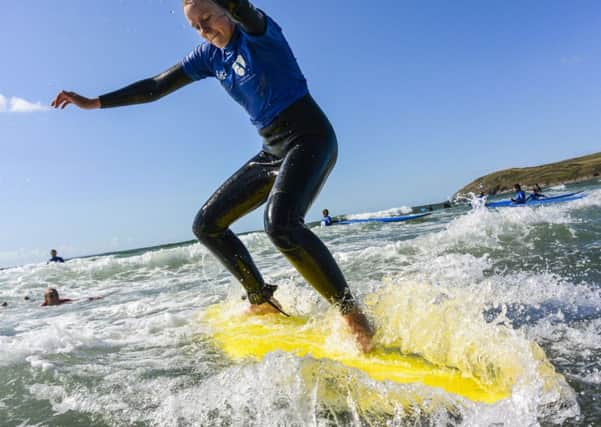Undated Handout Photo of Leanne Rinne having a surf lesson at Croyde Surf Academy in North Devon. See PA Feature TRAVEL Cornwall Devon. Picture credit should read: PA Photo/Handout/Gordon Dryburgh. WARNING: This picture must only be used to accompany PA Feature TRAVEL Cornwall Devon.