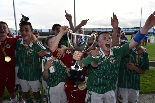 Northern Ireland players celebrate winning the inaugural Under-13 Dale Farm Milk Cup last summer.
