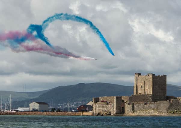 Red Arrows fly over Carrickfergus Castle on Armed Forces Day 2013. INCT 26-438-RM