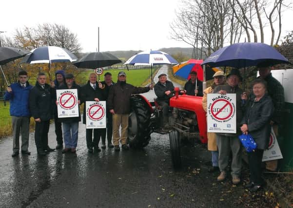 Boghill Road landowners, No-Arc21 campaigners and political representatives gathered at the entrance to Hightown Quarry to show their opposition to arc21's bid to acquire land for road widening as part of its plan to build a £240m energy from waste plant at the site. INNT 44-552CON