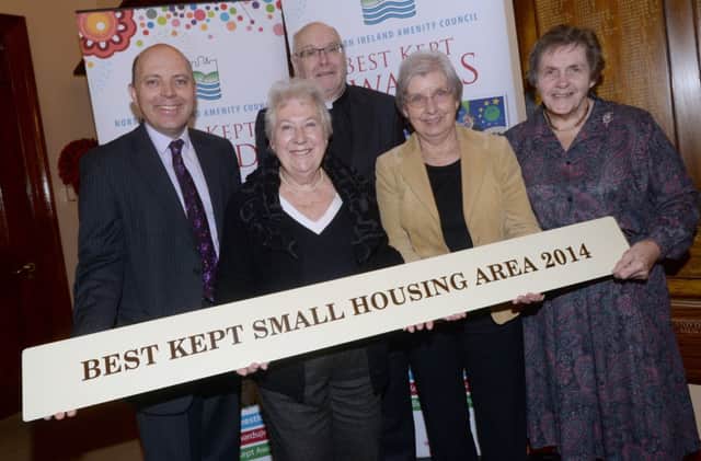 Garvey Court in Lisburn was crowned the Best Kept Small Housing Area at the 2014 Best Kept Towns, Villages and Housing Areas awards. 

Pictured (l-r): Dave Foster, Department of the Environment, Jean Reid, The Reverend Robert Henderson and Dorothy Ferguson from Garvey Court with Doreen Muskett MBE, Chair of the Northern Ireland Amenity Council.