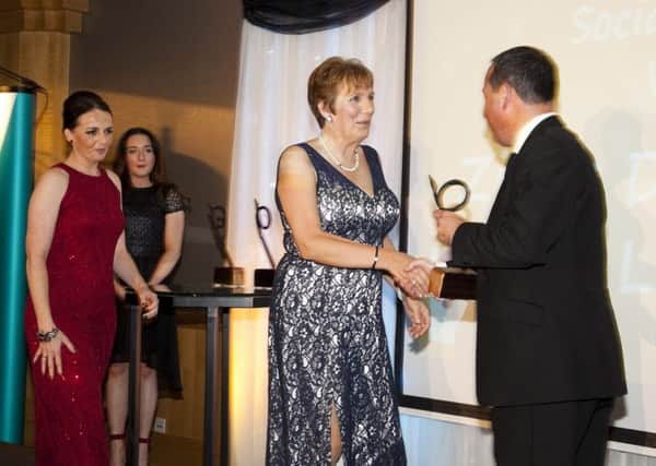 Roy McGivern presents Janice Bunting and Grainne Thornton with the award.