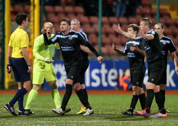 Ballymena United's players dispute referee Ian McNabb's decision to award Cliftonville a penalty in tonight's Toals County Antrim Shield quarter-final at Solitude. Picture: Press Eye.