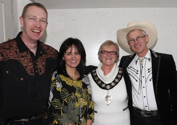 Pictured before the start of one of last year's Christmas shows was  Mayor Audrey Wales with Alison Moore of Children's Heartbeat, which received proceeds from the event, and  country artists Fiddler Adam (left) and Kenny Archer. INBT 07-103JC
