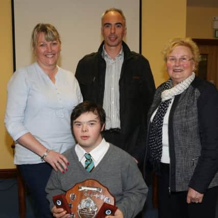 Alan Mulholland who received Sally McAuley Shield at the Castle Towers Secondary prize day is seen here with his mum Dawn, dad Noel and grandmother Ella McCaughey. INBT 44-107JC