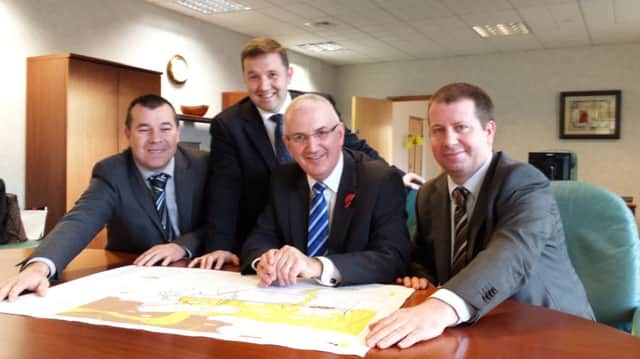 North Antrim UUP MLA Robin Swann and his party colleague, Danny Kennedy MLA, the Transport Minister along with representatives from BAM and FP McCanns discuss the final plans for the next section of the A26 dualling scheme. inbm45-14s