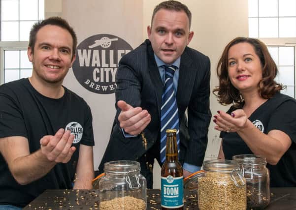 James Huey and Louise Whearity from the Walled City Brewery pictured with Ilex's Business Manager Niall McGurk. Picture Martin McKeown. Inpresspics.com