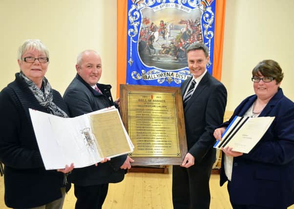 Photographed in Ballymarlow Orange Hall last week to promote thei r exhibition on the lodge members who died in WW1 were Roberta MacAuley, Councillor Reuben Glover, Paul Frew, MLA: and Karen Barr. INBT 45-809H