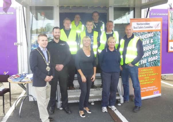 Mayor Thomas Hogg with the team who provided the car checks at the Vehicle Roadshow, which was held recently at Abbey Retail Park. Joining him (front row) are: Lisa Bailie from Bailies Auto Refinishers, Pam Brown from Newtownabbey Road Safety Committee and David Currie, Environmental Health Officer. INNT 44-547CON