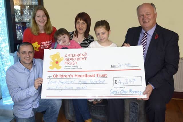 Sarah Quinlan from Children's Heartbeat Trust accepted a cheque for £4347:00, proceeds from Grace's Coffee Morning, from the McKee family, Aaron, Judith, Rebecca and Grace and David Simpson MP towards Children's Heartbeat Trust © Edward Byrne Photography INBL1444-215EB