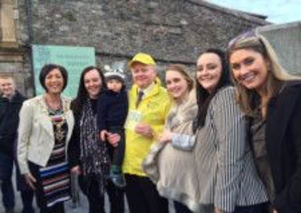 Londonderry man Martin McCrossan received a 'People Like You' award from UTVs Sarah Travers, Mayor Brenda Stevenson, and his family and friends last week. 
Martin, who works for the local tourism office, was surprised by Sarah during one of his guided tours of the Walls. 
Martin was nominated by his daughter Charlene for his passion for Londonderry and for raising over £150,000 for the local Foyle Hospice.