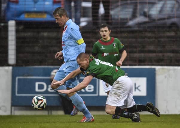 Ballymena United skipper Allan Jenkins in action against Glentoran's Stephen McAlorum during Saturday's match at the Oval. Picture: Press Eye.