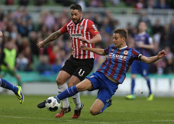 St Patrick's Athletic skipper Ger O'Brien slides in to win possession from Derry City's Rory Patterson, during the FAI Ford Cup Final, at the Aviva Stadium. Picture by Donall Farmer/INPHO
