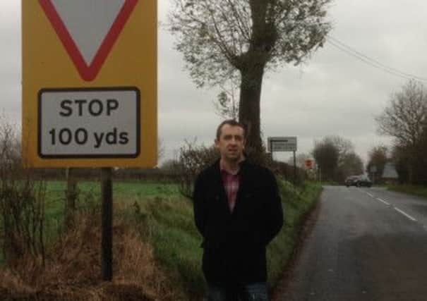Local SF MLA Daithí McKay at Lisnahunshin Road where safety measures such as additional signage and rumble strips leading up to the junction are being introduced.