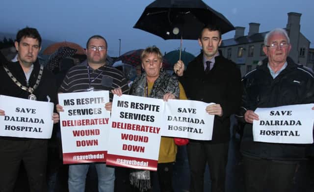 SAVE IT. Moyle Chairman, Cllr Donal Cunningham, MLA Daithi McKay, Cllr Seamus Blaney and supporters at the protest at Dalriada Hospital on Friday.INBM45-14 043SC.