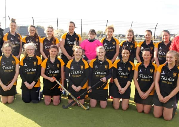 NEW LOOK. Players from Ballycastle hockey team, pictured  on Saturday in their new strip which was sponsored by Tessies The Quay, Ballycastle. Included is coach David McMullan and Kate Bakewell from Tessies.INBM45-14 039SC.