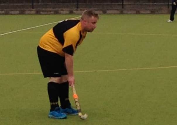 Andy Dalzell takes a breather on his way to five goals against North Down.