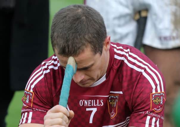 Cushendall's Sean Delargy is distraught after his team's win