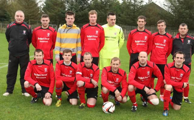 RED ALL ABOUT IT. Players and management from Balnamore, pictured prior to their home game against Windyhall on Saturday.INBM45-14 038SC.