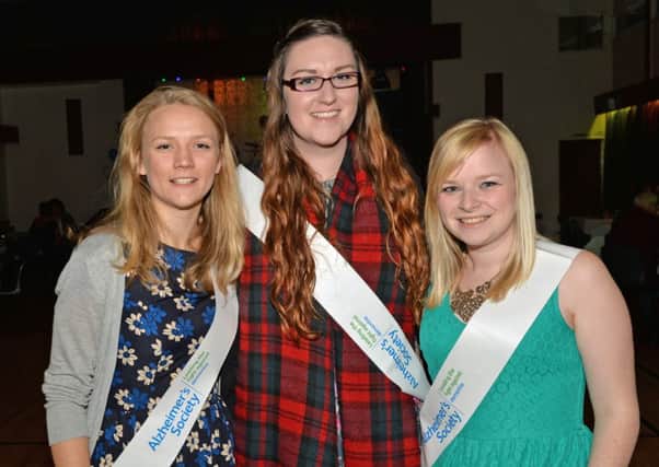 Pictured at the dance in the Blue Circle Club to raise funds for the Alzheimer`s Society are Emma Grier, Danielle Fenton and Laura McConkey. INLT 44-015-PSB