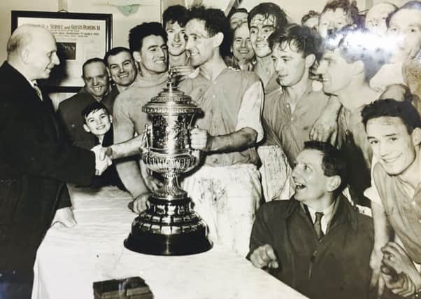 Francey Hughes receiving the Steel and Sons Cup trophy for Larne in 1956.