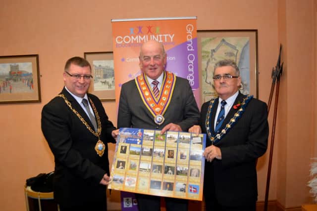 Edward Stevenson (centre), Grand Master of the Grand Orange Lodge of Ireland, with the Mayor of Carrickfergus, Charles Johnston (right) and his Larne counterpart,  Martin Wilson  at the launch of the Williamite trail poster. INCT 45-161-GR