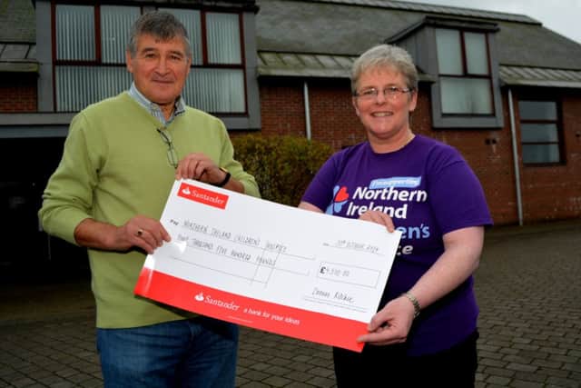 Jackie MacManus hands over a cheque for £4,500 to Catherine O'Hara, community appeals organiser, NI Children's Hospice. INNT 45-104-GR