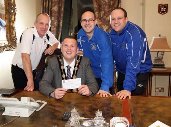 Ged Irwin, David Irwin and Simon Wragg from Distillery FC presenting Mayor Andrew Ewing with a cheque for £600 which the club raised for the Mayor's charity. US1445-517cd  Picture: Cliff Donaldson