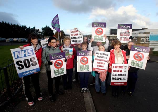 Workers at Dalriada Hospital in Ballycastle protest outside the building after a 1000 strong crowd turned out on Monday evening against the announcment to close the hospital.. Pic Steven McAuley