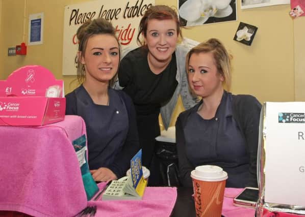 YOU BEAUTIES. Pictured at the NRC Ballymoney where Level 3 Beauty Students held a 'Wear It Pink' event to raise funds for Cancer Focus N.Ireland are from left, Annie Bailey, Hannah Fillis (Hair Beauty Technican) and Rachael McDonald.INBM44-14 008SC.