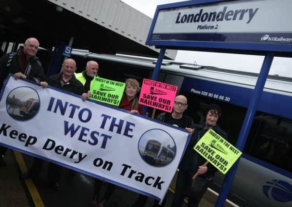 STATION PROTEST. . . .The Into The West 'Keep Derry on Track' group pictured protesting at Waterside Railway Station yesterday morning. DER4514MC038