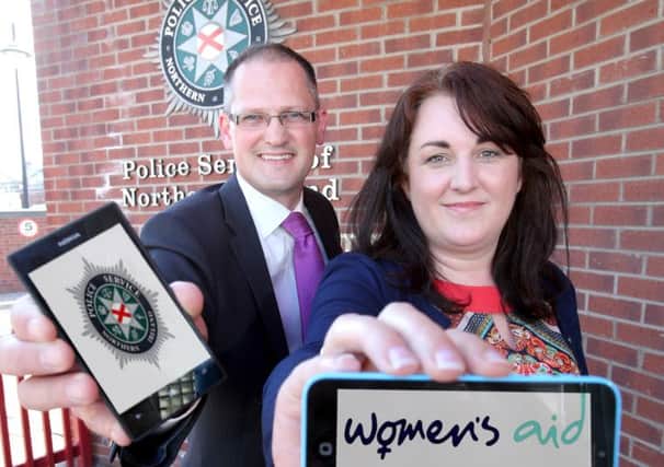 Detective Inspector Bob Blemmings, of the H District Public Protection Unit and Sharon Burnett of Causeway Womens Aid help launch the new online information pages to help signpost victims of domestic abuse.