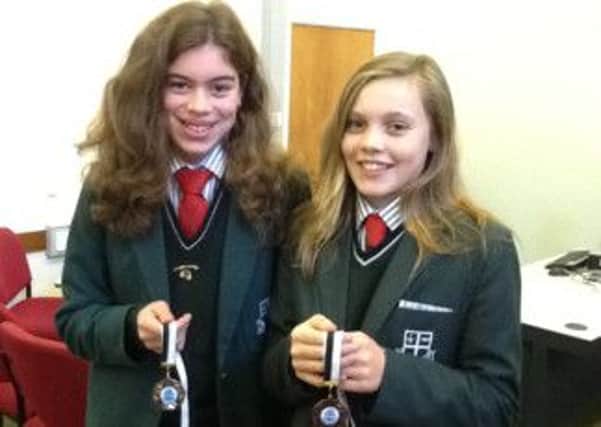 Molly Curry and Millie Dallas pictured with their Minor Schools Swimming medals.