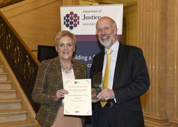 Justice Minister  Minister David Ford pictured with Anne Henry from the Hope Centre in Ballymena after she received a Highly Commended Award for their work with people suffering from addictions and their families. Picture: Michael Cooper