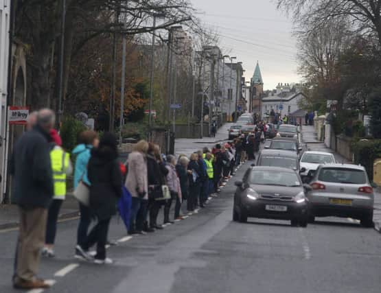 8th November 2014.. Ballycastle is brought to a standstill as hundreds protest at the Closure of Dalriada Hospital by forming a white line picket at lunch time in the town on Saturday. PICTURE STEVEN MCAULEY/MCAULEY MULTIMEDIA