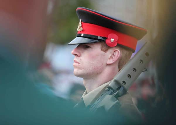 A TA soldier in pensive mood at Coleraine Remembrance Sunday.