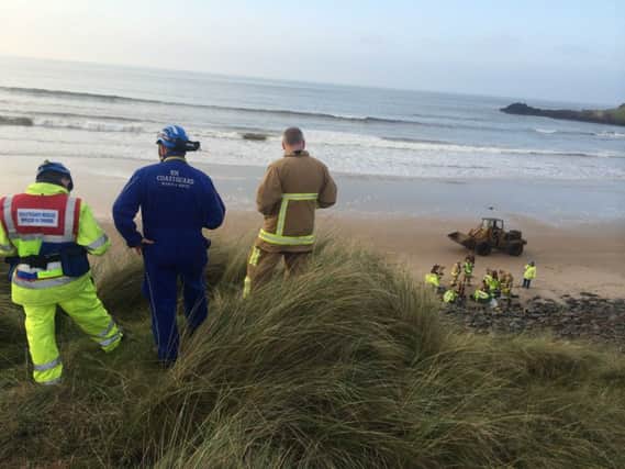 Specialist firefighters from the NIFRS and HM Coastguard attended a 40 Gallon Barrel that was washed onto Runkerry Beach at the Giant's Causeway on Sunday afternoon. PICTURE STEVEN MCAULEY/MCAULEY MULTIMEDIA. INBM46-14