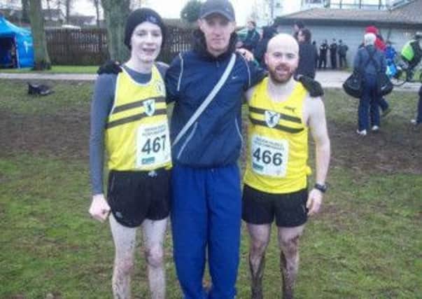 Connor McQuillan and Mark McKinstry with coach Gregory Walsh.