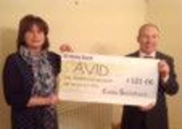 Carlin Solicitors has presented the Association of Visitors to Immigration Detainees (AVID) with a cheque for £101.06 which was raised through a street collection in Larne. INLT 46-650-CON