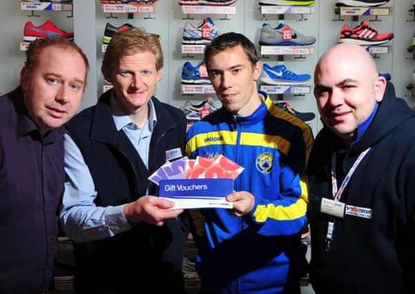 The Mid-Ulster Mail & Tyrone Times Sports Personality for the month of October Stephen McQuillan captain of Moyola Park FC pictured as he receives his winning vouchers from John McConnell of McConnell's Intersport. Included in the picture are Patrick Cullen (Mid-Ulster Mail & Tyrone Times Advertising Team Leader) and Gerard McSloy (Store Manager).INTT4614-318