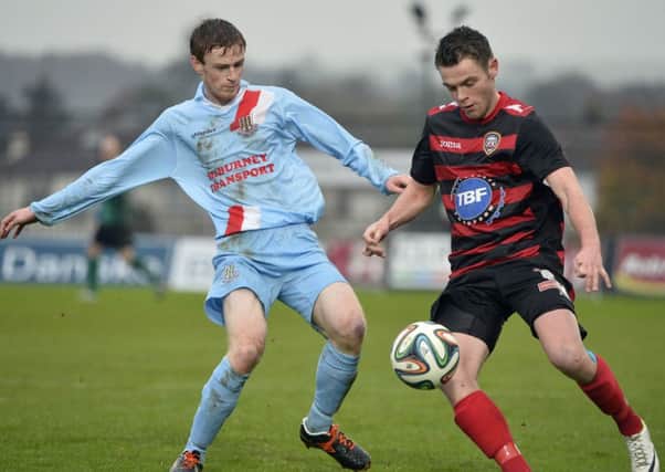 Ballymena's Aaron Stewart in action against Coleraine's Shane McGinty in Saturday's match. 
Picture: Press Eye.